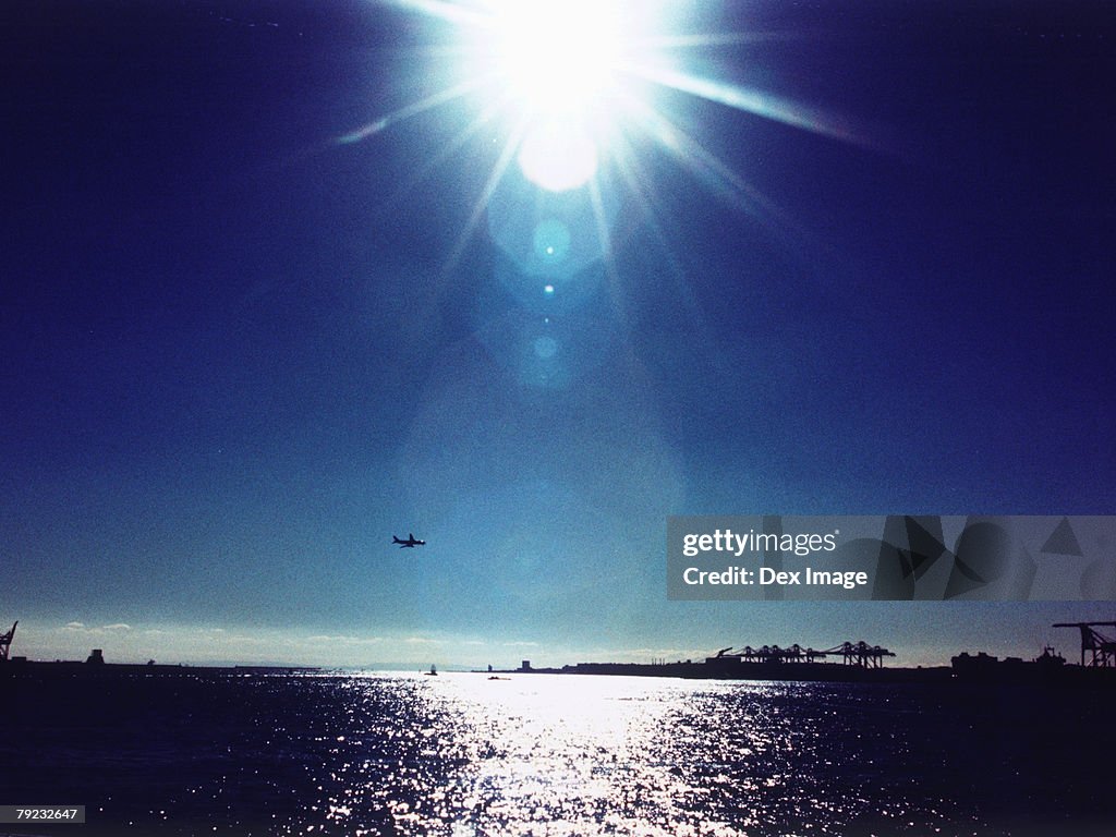 Sun shining over ocean, Tokyo Bay, Japan