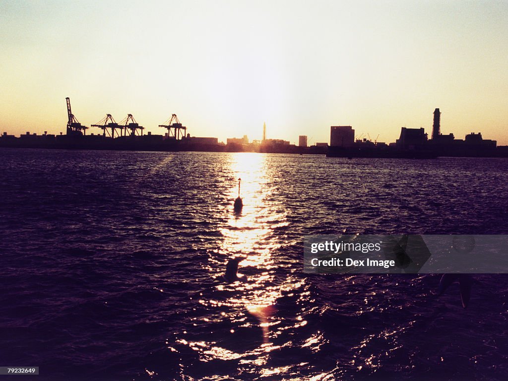 Sun setting over ocean, Tokyo Bay, Japan