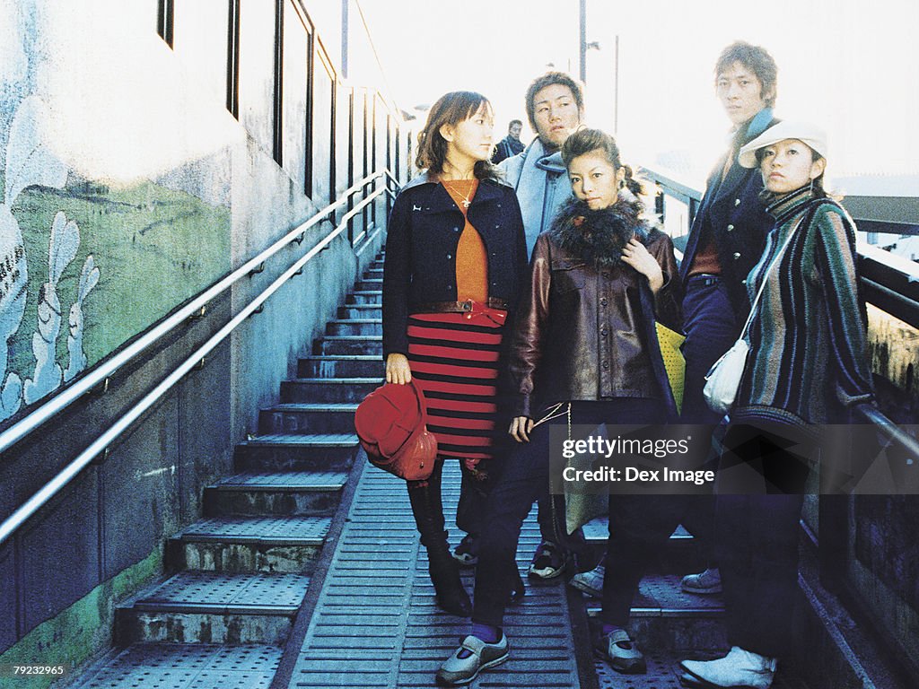 Group of people standing on staircase