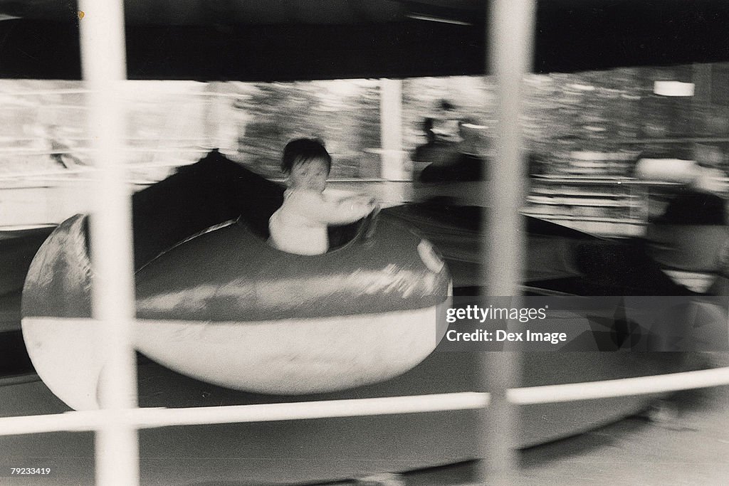 Boy on a amusement car ride