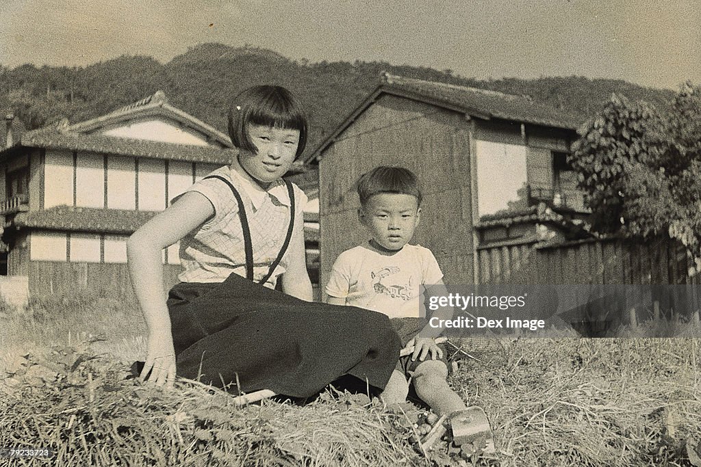 Elder Sister and younger brother at the backyard