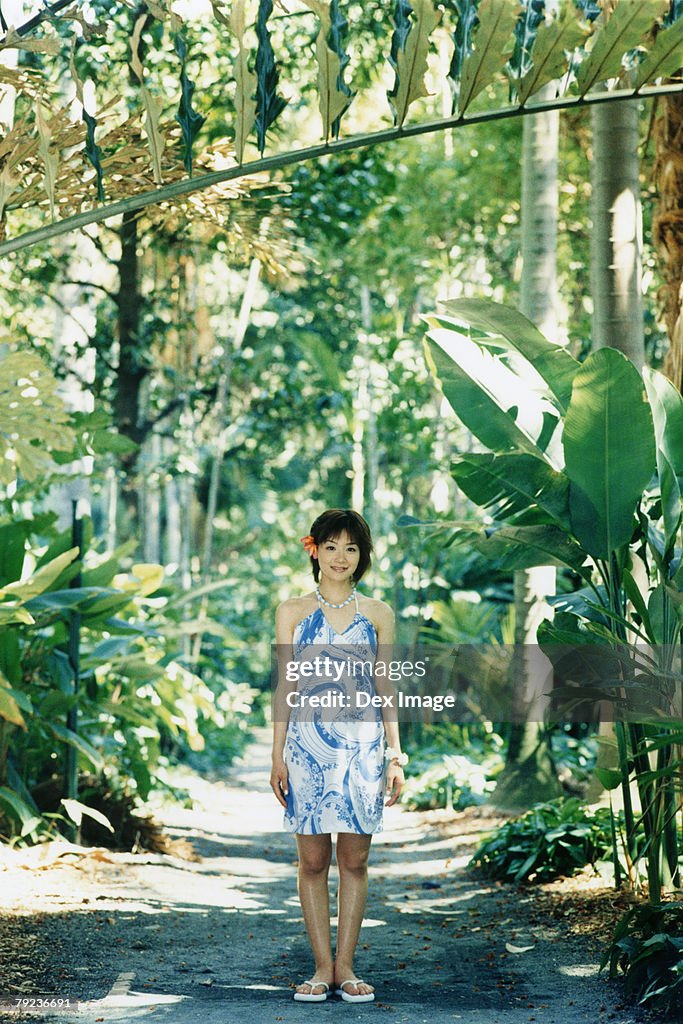 Young woman posing in Hawaiian blouse