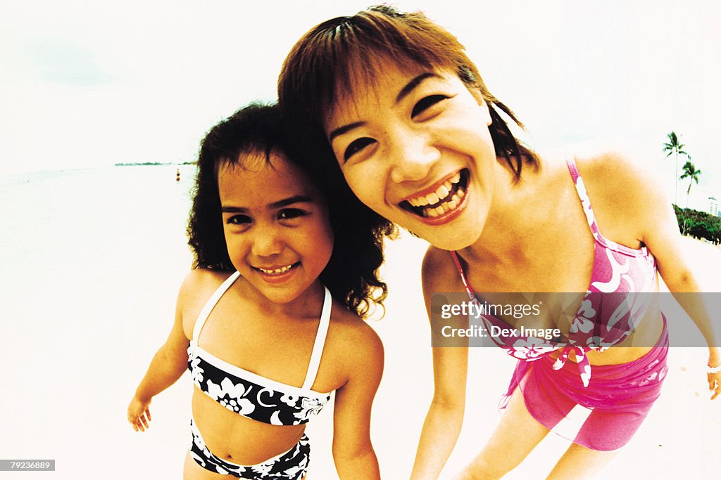 Young woman and Hawaiian girl, smiling