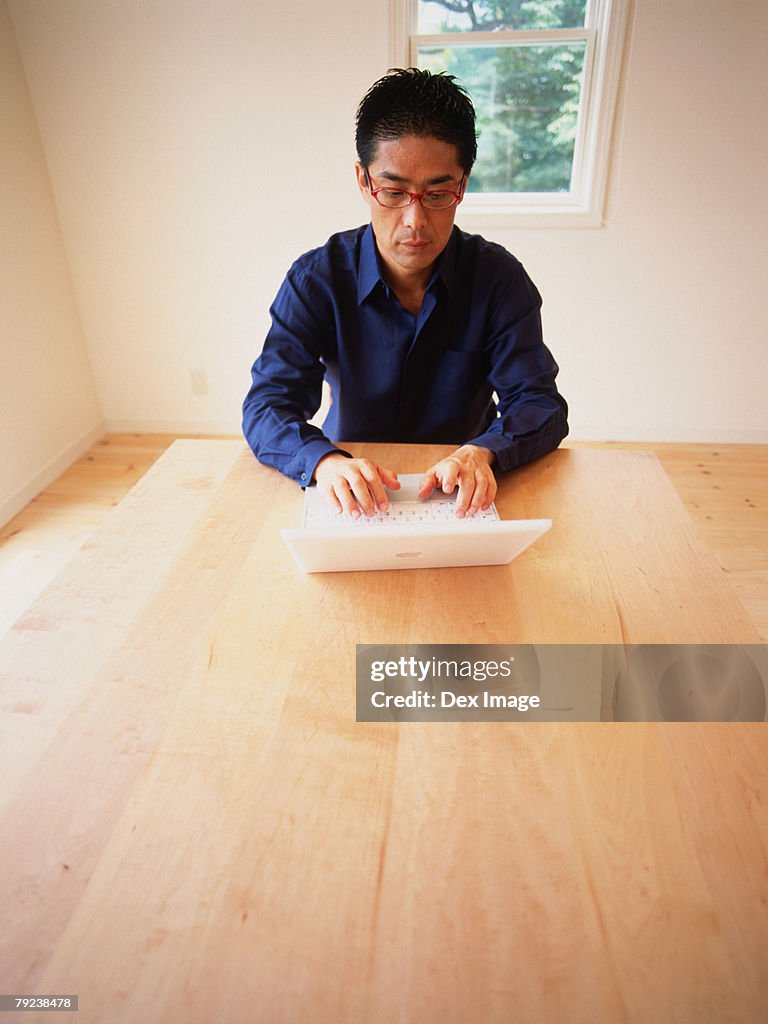 Man using laptop computer