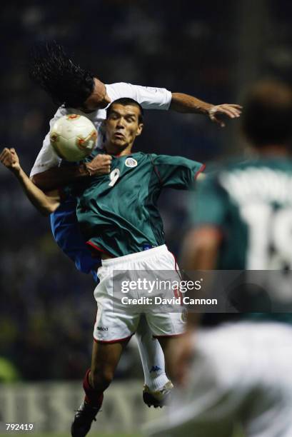 Jared Borgetti of Mexico loses out to Alessandro Nesta of Italy during the FIFA World Cup Finals 2002 Group G match played at the Oita Big Eye...