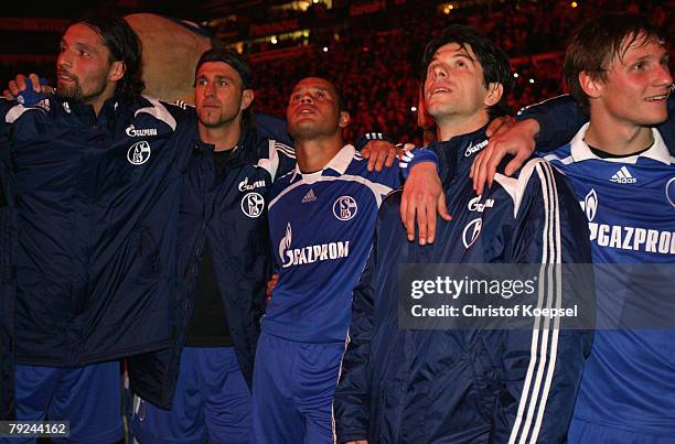 Kevin Kuranyi, Marcelo Bordo, Dario Rodriguez, Levan Kobiashvili and Benedikt Hoewedes of Schalke watch the firework to say farewell to Dario...