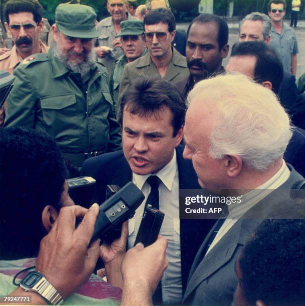 Foreign Minister, Eduard Shevardnadze , talks to the press during his departure from Cuba as president Fidel Castro looks on at Jose Marti...