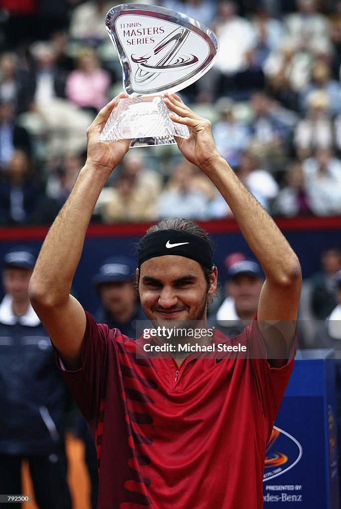 Roger Federer of Switzerland holds aloft the Masters Series trophy