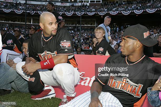 Albert Pujols of the St. Louis Cardinals talks to Jose Reyes of the New York Mets during the Home Run Derby at AT&T Park in San Francisco, California...