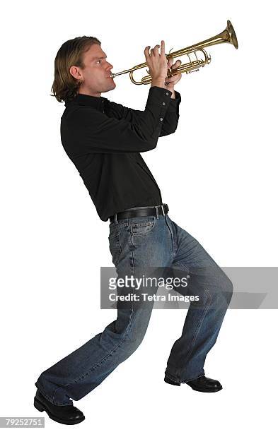 man playing horn - trumpet stockfoto's en -beelden