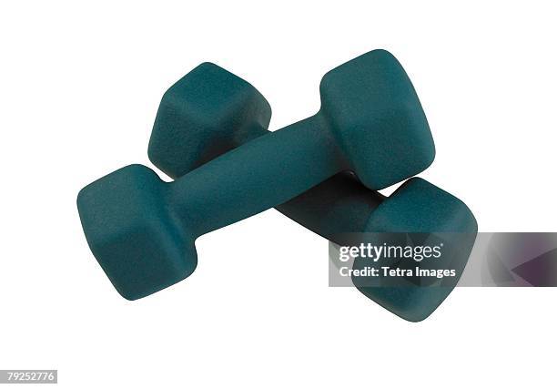 a pair of free weights - exercise equipment stock pictures, royalty-free photos & images