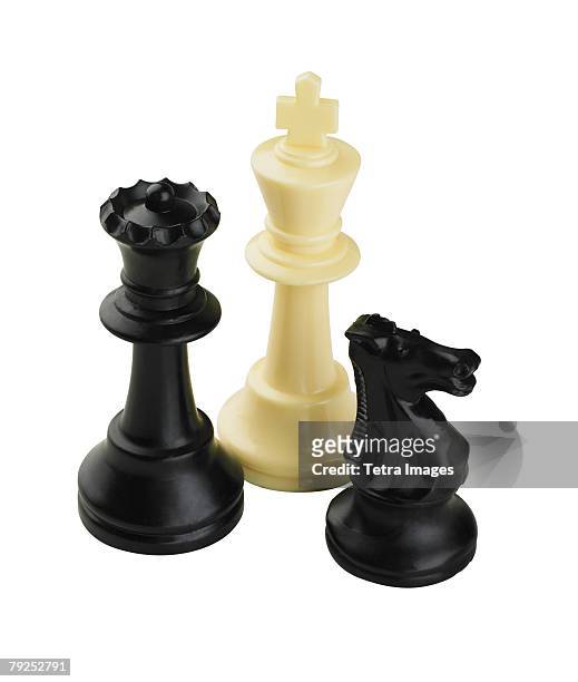 closeup of three chess pieces - chess piece stock pictures, royalty-free photos & images