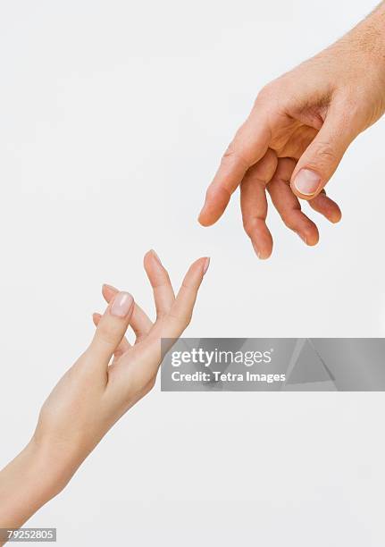 two hands about to touch - reiken stockfoto's en -beelden