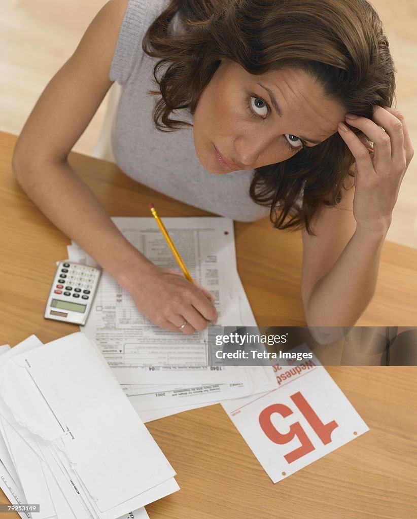 Woman working against tax deadline