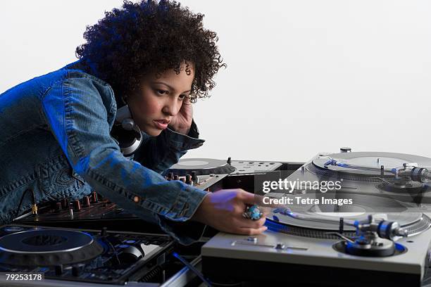 woman working at a mixing board - record scratching stock pictures, royalty-free photos & images