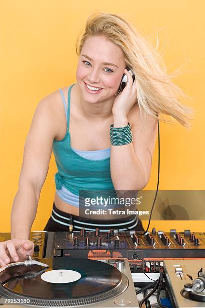 woman working at a mixing board - record scratching stock pictures, royalty-free photos & images