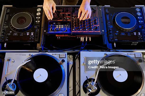 person mixing music in a nightclub - dj decks stock pictures, royalty-free photos & images