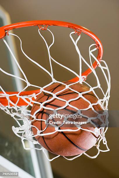 close up of basketball in hoop - basketball net stockfoto's en -beelden
