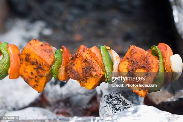 close-up of a paneer tikka being prepared - paneer tikka stock pictures, royalty-free photos & images