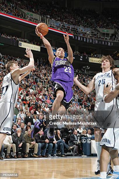 Kevin Martin of the Sacramento Kings sails through Andrei Kirilenko and Kyle Korver of the Utah Jazz for a shot at EnergySolutions Arena on January...