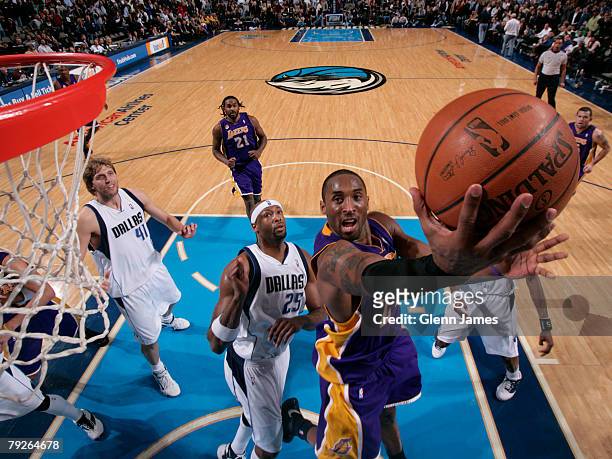 Kobe Bryant of the Los Angeles Lakers takes the ball to the basket against the Dallas Mavericks on January 25, 2008 at the American Airlines Center...
