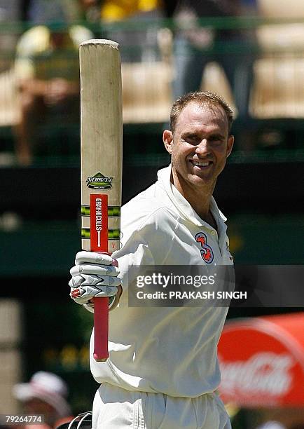 Australia's Mathew Hayden raises his bat after his century against India during day three of the fourth and final Test match at the Adelaide Oval...