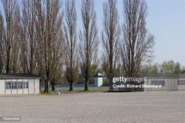 The two reconstructed barracks, with a guard tower between them, at the site of the former Dachau Nazi concentration camp in Bavaria, Germany, 2014....