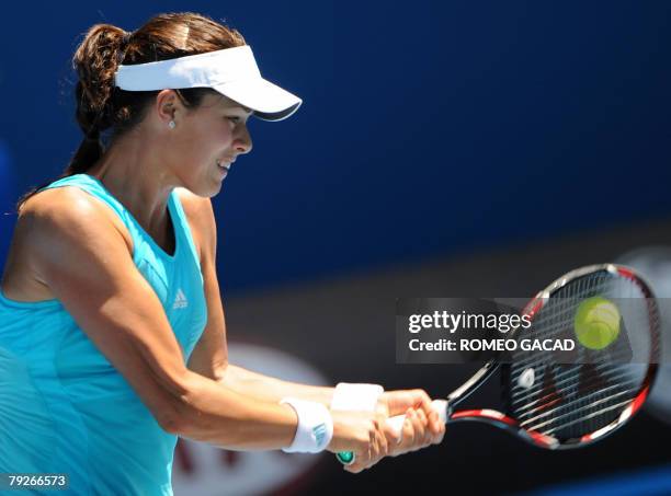 Serbian tennis player Ana Ivanovic plays a backhand return during her womens singles final against Russian opponent Maria Sharapova at the Australian...