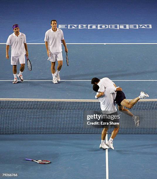 Jonathan Erlich and Andy Ram of Israel celebrate winning championship point after their men's doubles match against Michael Llodra and Arnaud Clement...