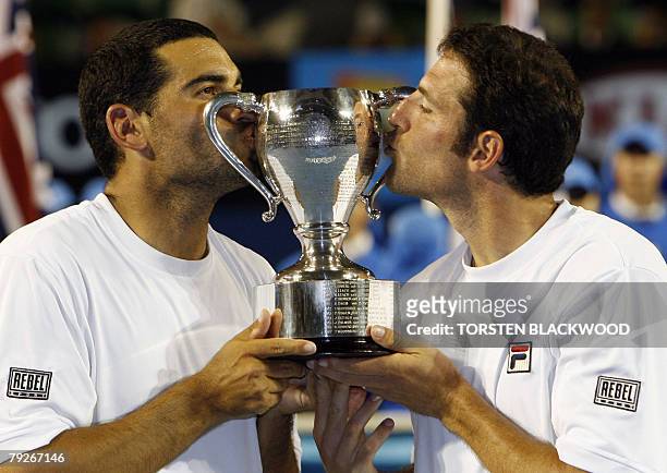 Israeli tennis players Andy Ram and Jonathan Erlic kiss the winners trophy after victory in their mens doubles final match against French opponents...