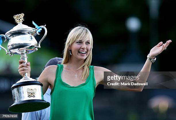 Maria Sharapova of Russia poses with the Daphne Akhurst Memorial Cup on a boat along the Yarra River after her victory in the women's final match...