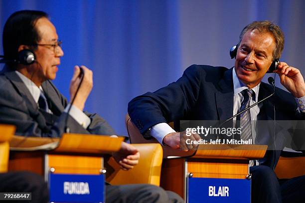 Yasuo Fukuda, Prime Minister of Japan, and former British Prime Minister and current UN Middle East envoy, Tony Blair, attend the fourth day of the...