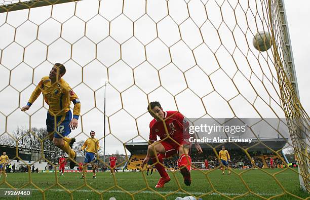 Jake Buxton of Mansfield Town heads the ball in to his own net under pressure from Stewart Downing of Middlesbrough to score an own goal during the...