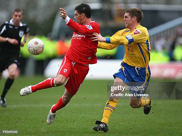 Jeremie Aliadiere of Middlesbrough controls the ball under pressure from Jake Buxton of Mansfield Town during the FA Cup 4th round match sponsored by...