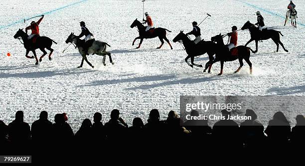 Spectators watch Team Maybach play Team Brioni for the Nespresso trophy on the third day of the 24th Cartier Polo World Cup on Snow on January 25,...
