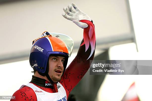 Jeff Christie of Canada acknowledges the fans after arriving in the finish area after competing during the men's final race of the 40th Luge World...