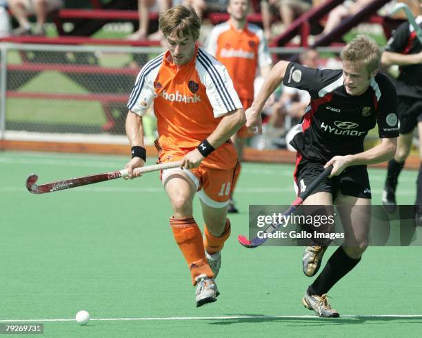 Rob Reckers of Netherlands on his way to score the 2nd goal chased by Maximillan Mueller of Germany during the Five Nations Mens Hockey tournament...