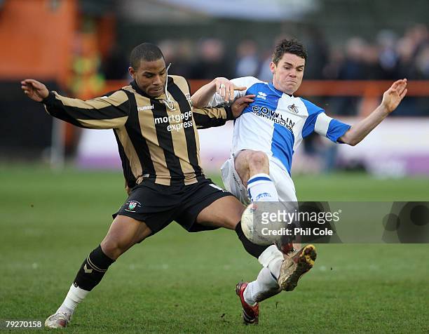 Jason Puncheon of Barnet gets tackled by Stuart Campbell of Bristol Rovers during the FA Cup Sponsored by E-on 4th Round match between Barnet and...
