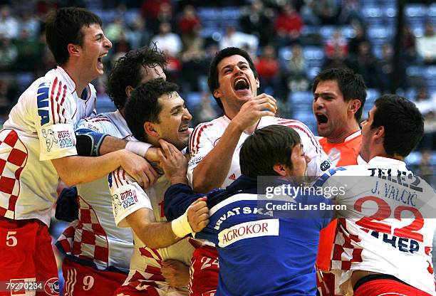 The players of Croatia celebrate after winning the Men's Handball European Championship semi final match between Croatia and France at the Hakons...