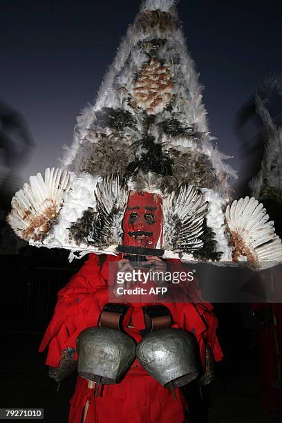 Bulgarian dancers known as a "kukeri" perform a ritual dance during the International Festival of the Masquerade Games in Pernik near Sofia, 26...
