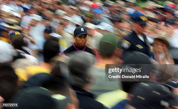 Tiger Woods walks through the gallery during the third round of the Buick Invitational on January 26, 2008 at the Torrey Pines Golf Course in La...