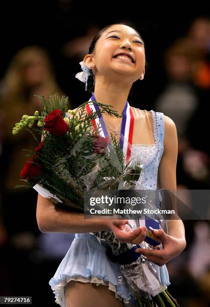 Mirai Nagasu smiles on the medals podium after winning the ladies event during the U.S. Figure Skating Championships at the Xcel Energy Center...