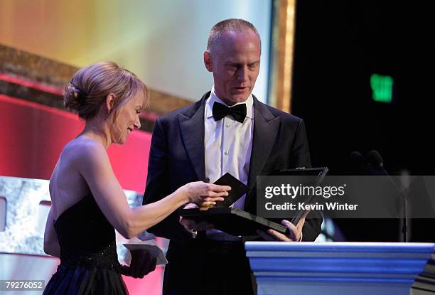 Actress Amy Ryan presents the award for Outstanding Directorial Achievement in Dramatic Series Night to director Alan Taylor onstage during the 60th...