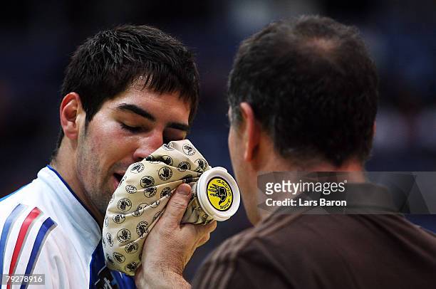 Nikola Karabatic of France is seen with ice on his face during the Men's Handball European Championship Third Place Play-off match between Germany...