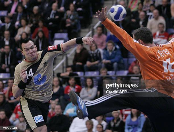 Germany's right back Christian Zeitz shoots at France's goalkeeper Thierry Omeyer during their 8th Men's European Handball Championship Final match...