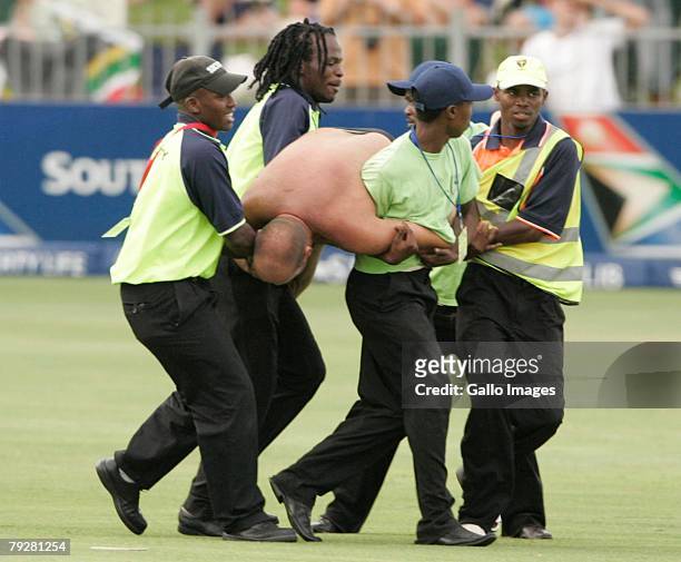 Security removes an intruder off the field during the 3rd ODI between South Africa and West Indies held at Sahara Oval St Georges on January 28, 2008...