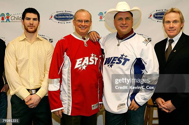 Atlanta Thrasher's player Jim Slater, Jim Tally, CEO of the Children's Healthcare of Atlanta, singer Garth Brooks and Paul Kelly, director of the...