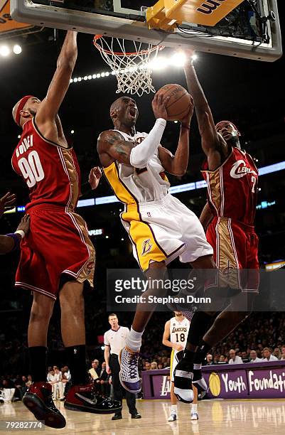 Kobe Bryant of the Los Angeles Lakers goes up for a shot between Drew Gooden and LeBron James of the Cleveland Cavaliers at Staples Center January...