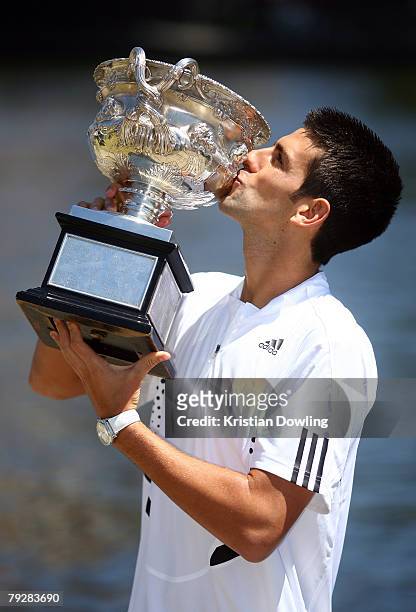 Novak Djokovic of Serbia poses with his trophy following his victory at the Men's Singles at the Australian Open 2008 January 28, 2008 in Melbourne,...