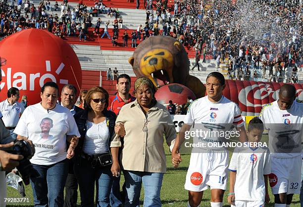 Orfilia de Palacios , the mother of Honduran footballer Edwin Rene Palacios, walks in the field after asking for the release of her son during the...